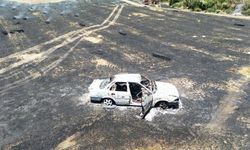 Adana'da park halindeki araçta çıkan yangın ormanlık alana sıçradı